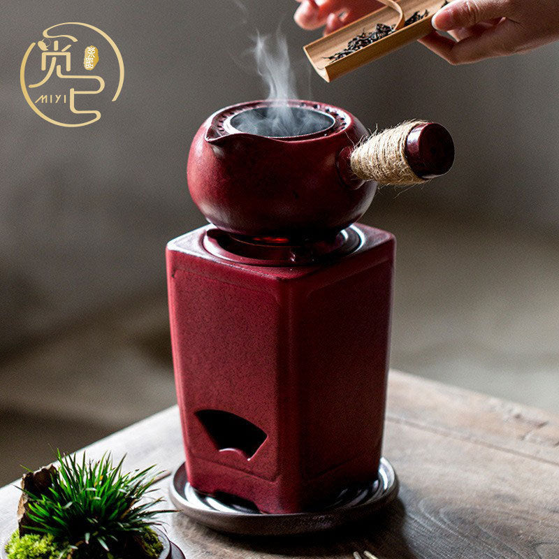 Teiera con stufa a carbone