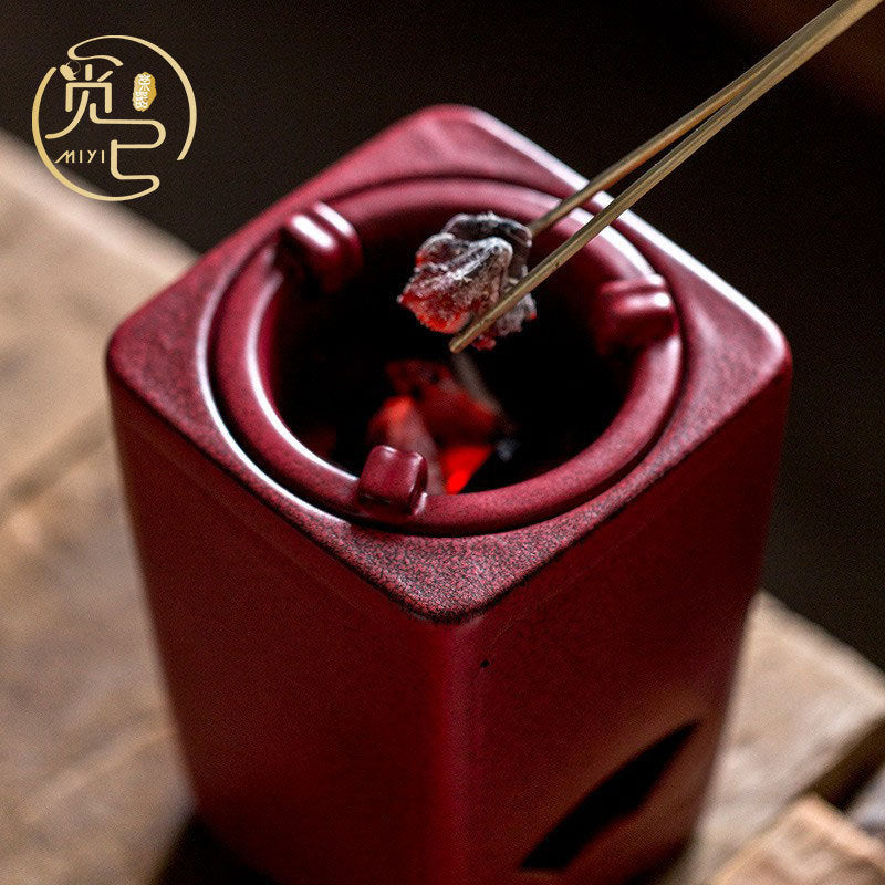 Teiera con stufa a carbone